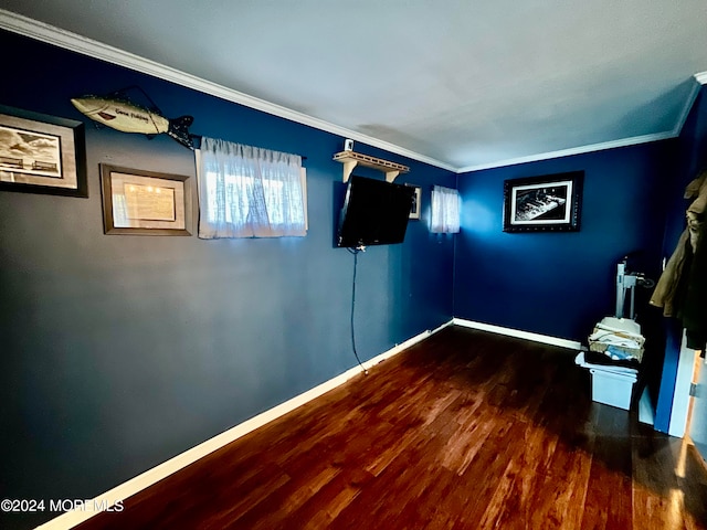 interior space with ornamental molding and dark wood-type flooring