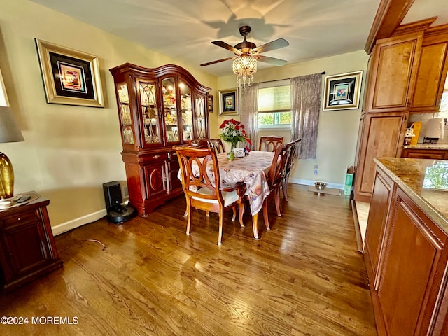 dining space featuring hardwood / wood-style floors and ceiling fan