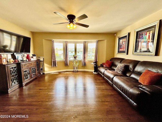 living room with wood-type flooring and ceiling fan