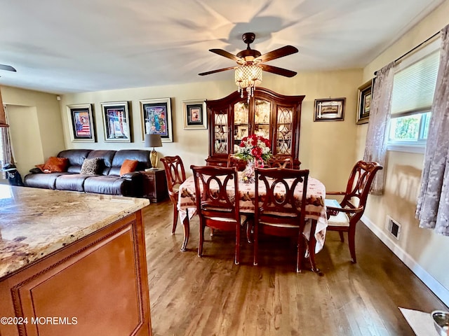 dining space featuring light hardwood / wood-style flooring and ceiling fan