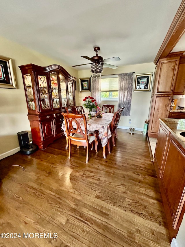 dining room featuring ceiling fan and dark hardwood / wood-style flooring