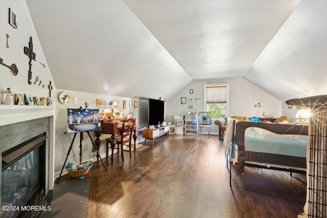 bedroom with lofted ceiling and hardwood / wood-style floors