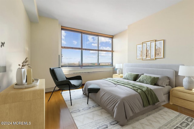 bedroom with wood finished floors