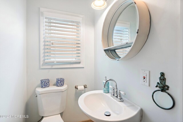 304 Bay Blvd, Seaside Heights, NJ 08751 - half bath featuring a sink, healthy amount of natural light, and toilet