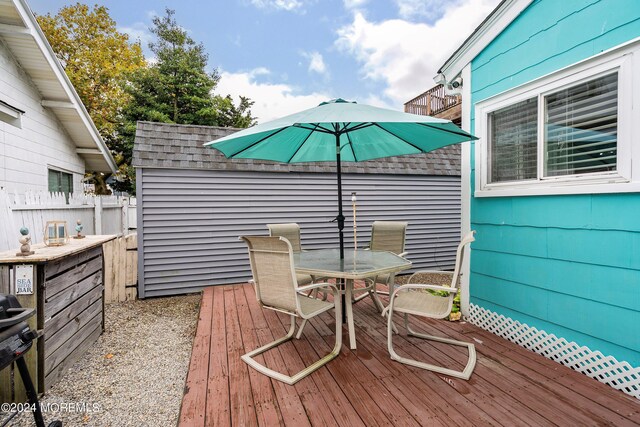 304 Bay Blvd, Seaside Heights, NJ 08751 - wooden terrace with outdoor dining space and fence