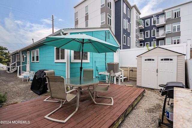 304 Bay Blvd, Seaside Heights, NJ 08751 - wooden deck featuring a shed, an outdoor structure, fence, cooling unit, and area for grilling