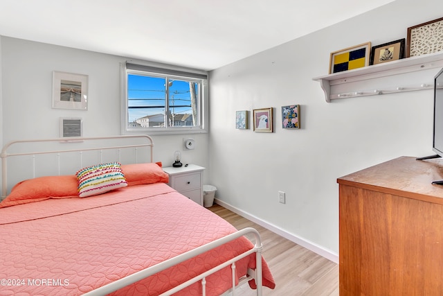 bedroom with light wood-type flooring