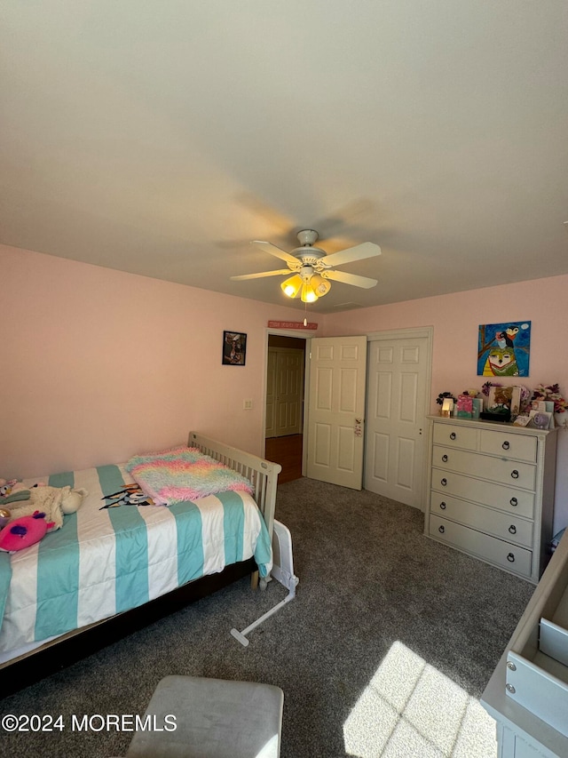 bedroom featuring carpet, a closet, and ceiling fan