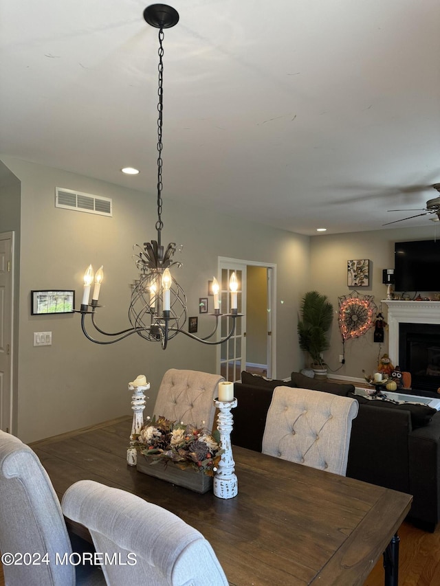 dining room with ceiling fan and dark hardwood / wood-style floors