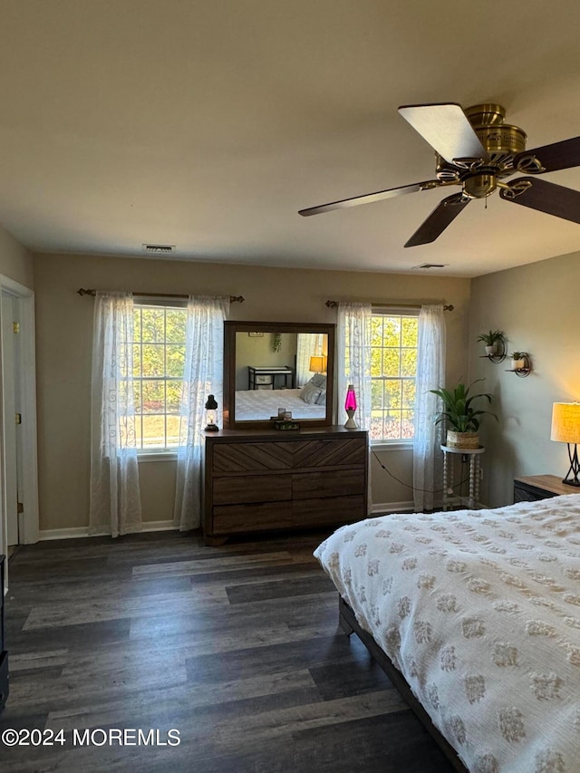 bedroom featuring dark wood-type flooring and ceiling fan