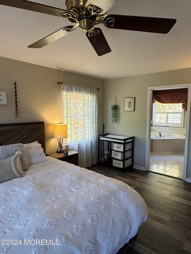 bedroom with ceiling fan, wood-type flooring, and ensuite bathroom