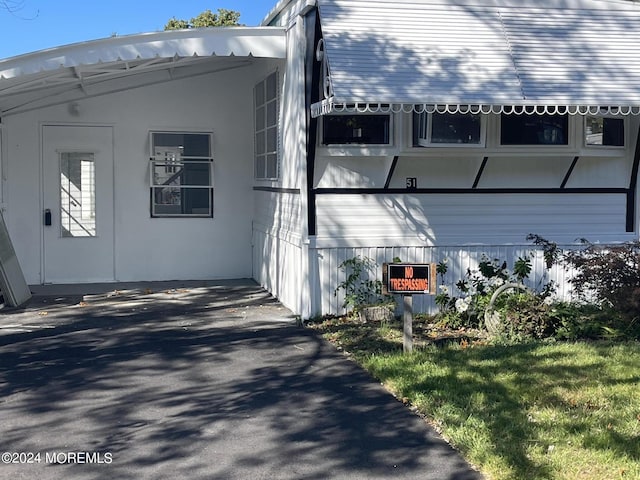 view of home's exterior featuring a yard