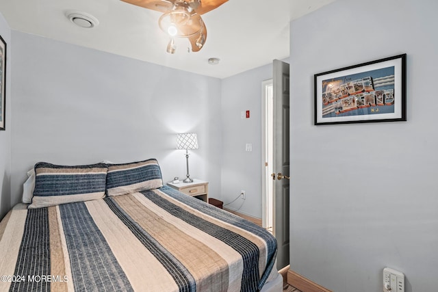 bedroom featuring ceiling fan and hardwood / wood-style floors