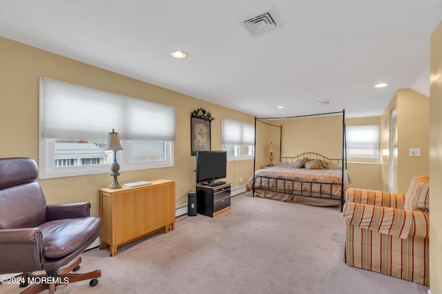 carpeted bedroom featuring a baseboard radiator