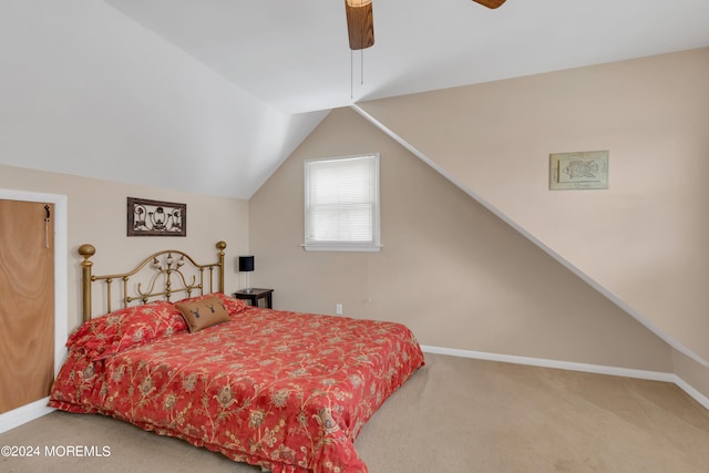 carpeted bedroom with vaulted ceiling and ceiling fan