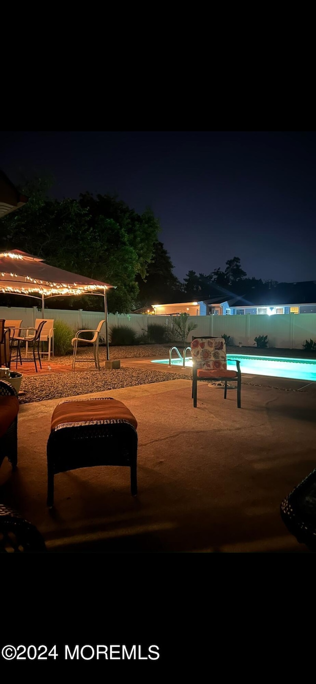 view of home's community featuring a patio area and a swimming pool