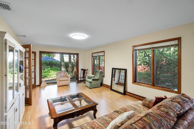 living room with light hardwood / wood-style flooring