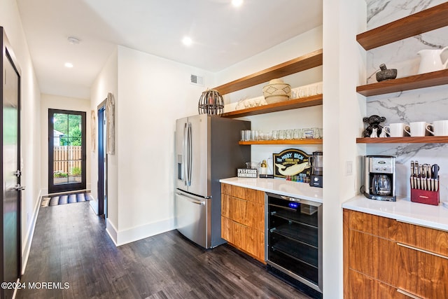 bar featuring beverage cooler, dark hardwood / wood-style floors, tasteful backsplash, and stainless steel fridge with ice dispenser