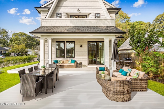 back of property featuring an outdoor living space and a deck