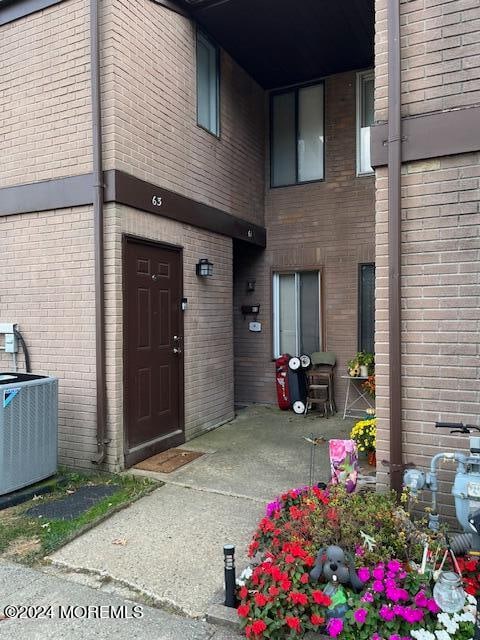 entrance to property with cooling unit