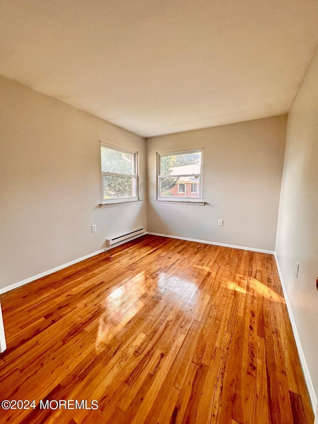 259 Laurel Pl Unit A, Manchester, NJ 08759 - spare room featuring wood finished floors, baseboard heating, and baseboards