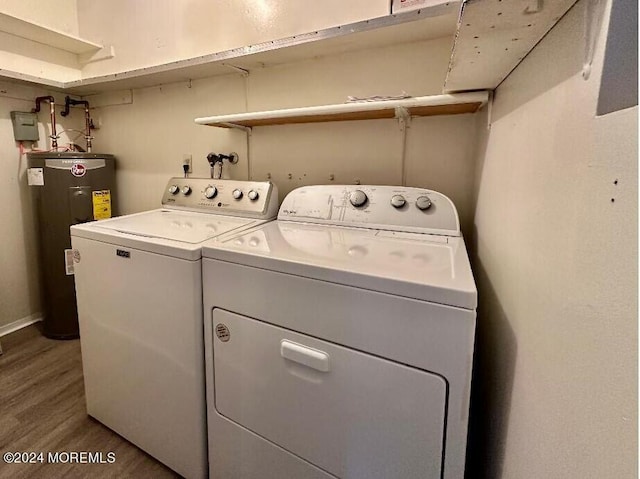 laundry room with hardwood / wood-style flooring, washer and clothes dryer, and water heater