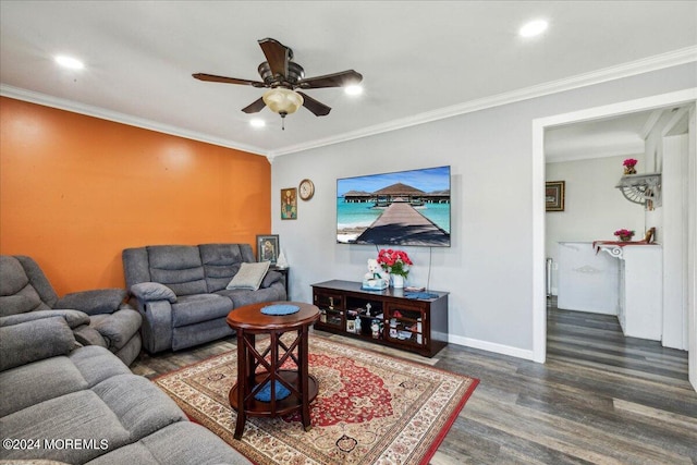 living room with crown molding, ceiling fan, and dark hardwood / wood-style flooring