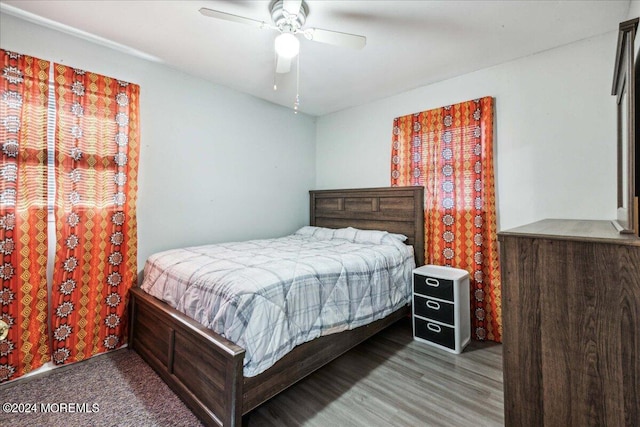 bedroom featuring ceiling fan and hardwood / wood-style floors