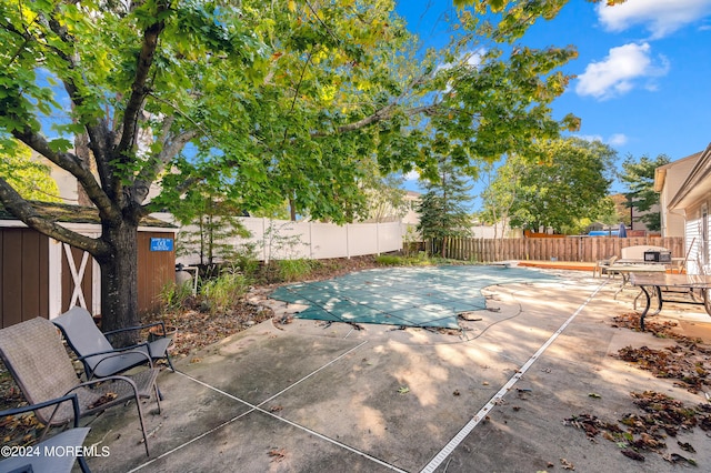 view of swimming pool featuring a patio