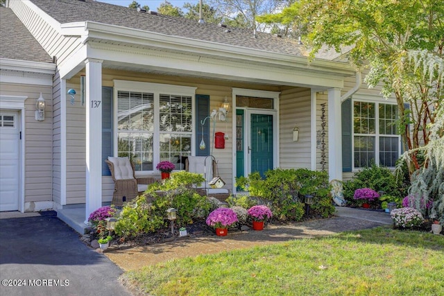 doorway to property featuring covered porch