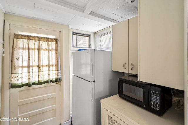 204 19th Ave, Belmar, NJ 07719 - kitchen with freestanding refrigerator, black microwave, and light countertops