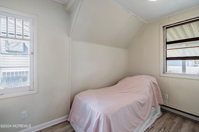 204 19th Ave, Belmar, NJ 07719 - bedroom with a baseboard radiator, wood finished floors, and lofted ceiling