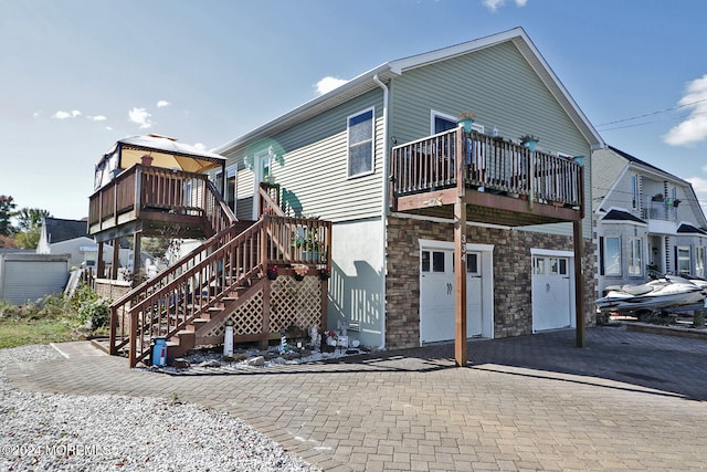 exterior space featuring a balcony and a garage