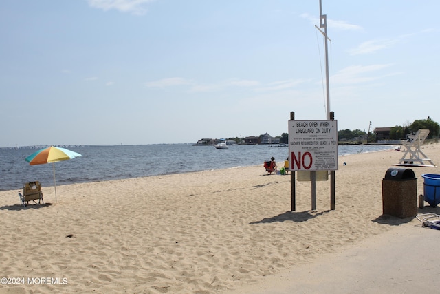 property view of water featuring a view of the beach