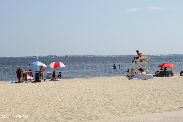 property view of water featuring a beach view