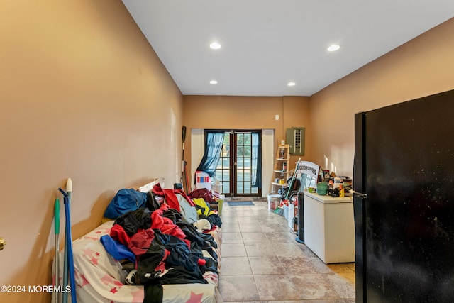 interior space with black refrigerator