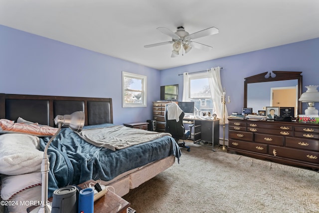 bedroom featuring ceiling fan, carpet flooring, and a baseboard heating unit