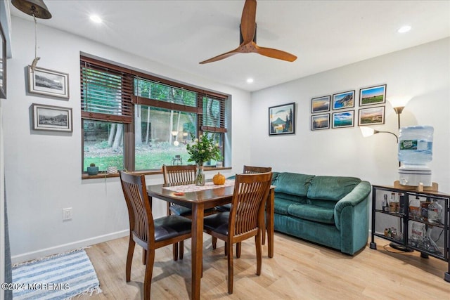 dining area featuring light hardwood / wood-style flooring and ceiling fan