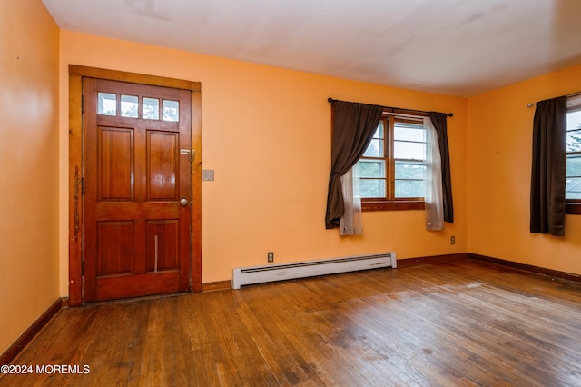 entryway featuring baseboard heating and hardwood / wood-style flooring