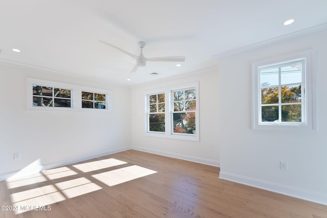 empty room featuring ornamental molding, light wood finished floors, baseboards, recessed lighting, and ceiling fan