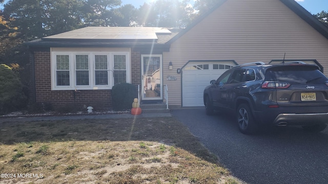 view of front of home with a garage