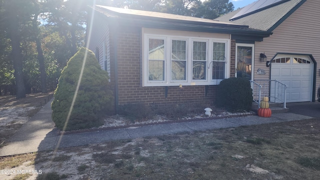 view of home's exterior with a garage