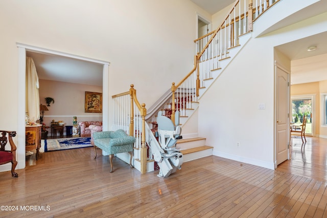 staircase with hardwood / wood-style floors