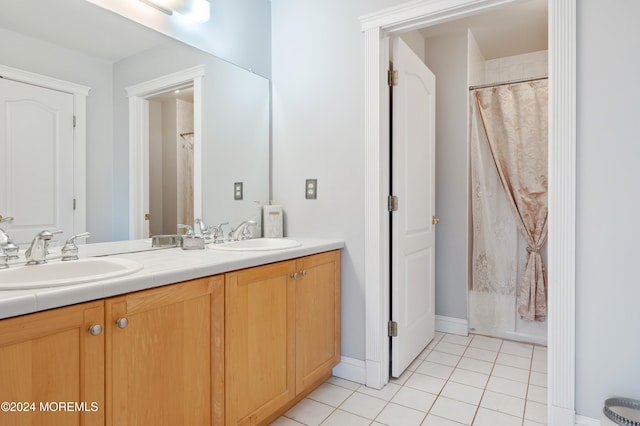 bathroom with vanity and tile patterned flooring