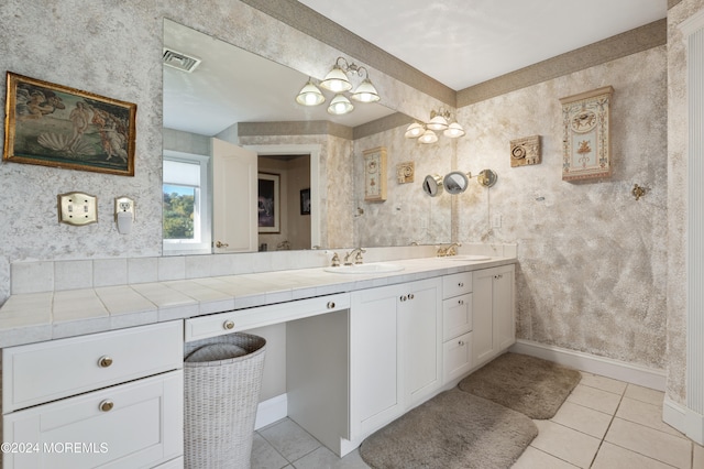 bathroom with vanity and tile patterned flooring