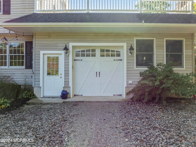 garage featuring wooden walls