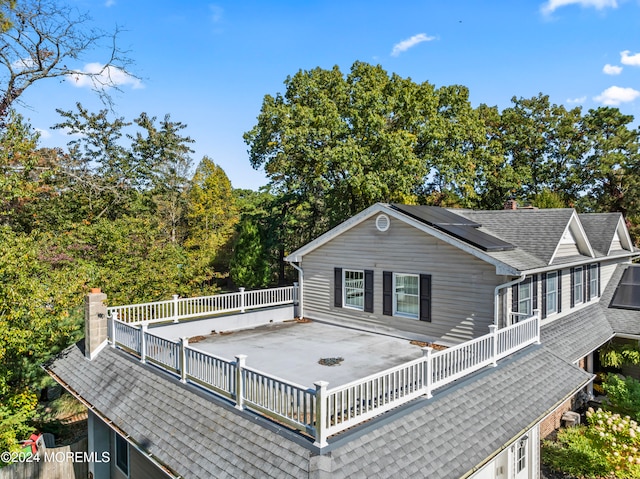 view of home's exterior with a wooden deck