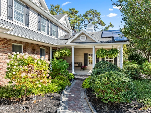 doorway to property featuring a porch