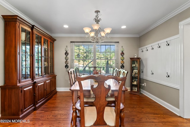 dining room with crown molding, a chandelier, and dark hardwood / wood-style flooring