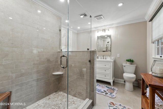 bathroom with vanity, toilet, ornamental molding, and a shower with shower door